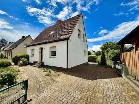 Vorder- und Seitenansicht Vorder- und Seitenansicht - Einfamilienhaus in 48432 Rheine mit 92m² kaufen
