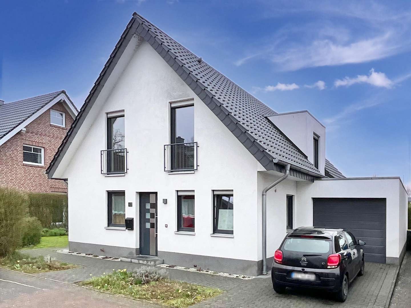 Vorder- und Seitenansicht - Einfamilienhaus in 48493 Wettringen mit 136m² kaufen