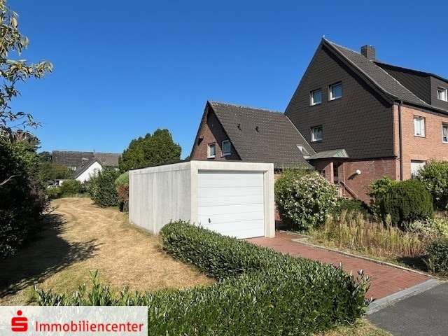 Ansicht mit Garage - Doppelhaushälfte in 46282 Dorsten mit 124m² kaufen