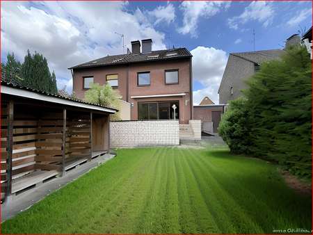 Rasenfläche + Holzunterstand + Holzhaus + Terrasse - Doppelhaushälfte in 46282 Dorsten mit 120m² kaufen