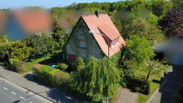 Seitenansicht - Einfamilienhaus in 32791 Lage mit 84m² kaufen