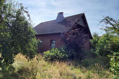 Ansicht vom Garten - Zweifamilienhaus in 32289 Rödinghausen mit 187m² kaufen