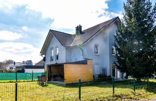 Seitenansicht - Doppelhaushälfte in 56477 Rennerod mit 151m² kaufen