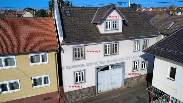 Luftaufnahme Vorderseite - Dachgeschosswohnung in 35415 Pohlheim mit 82m² kaufen