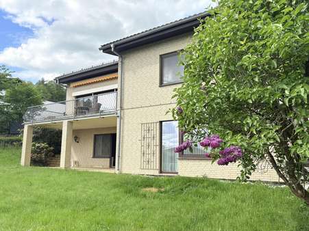 Gartenansicht - Einfamilienhaus in 35444 Biebertal mit 128m² kaufen