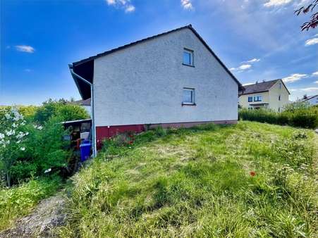 Seitenansicht - Einfamilienhaus in 34537 Bad Wildungen mit 113m² kaufen