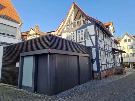 Ansicht mit Garage - Einfamilienhaus in 36251 Bad Hersfeld mit 150m² kaufen