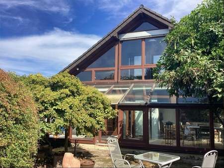 Hausansicht mit Wintergarten Hausansicht mit Wintergarten - Fertighaus in 36199 Rotenburg mit 133m² kaufen