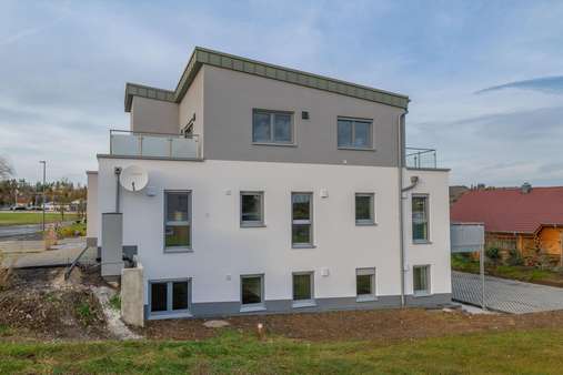 Seitenansicht - Erdgeschosswohnung in 56766 Ulmen mit 75m² kaufen