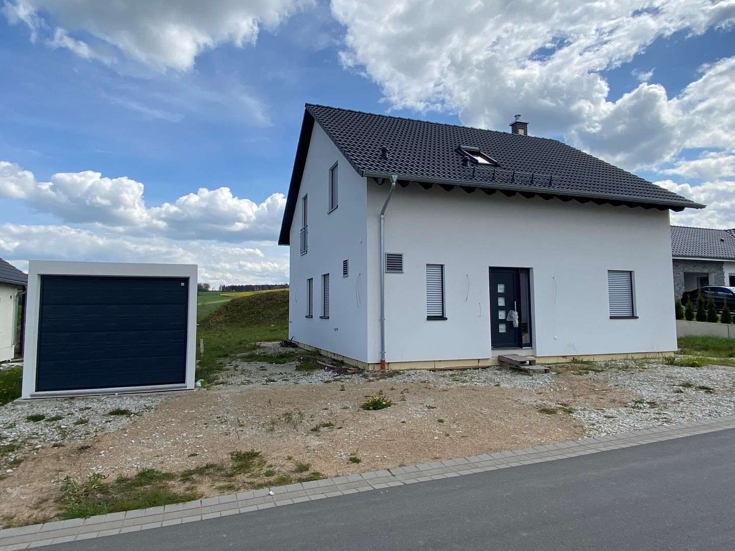 Straßenansicht - Einfamilienhaus in 56843 Lötzbeuren mit 135m² kaufen