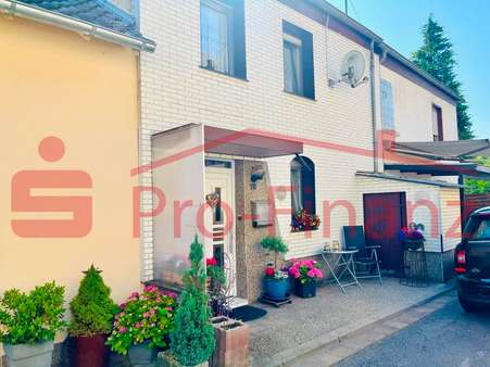 Seitenansicht - Einfamilienhaus in 66352 Großrosseln mit 85m² kaufen