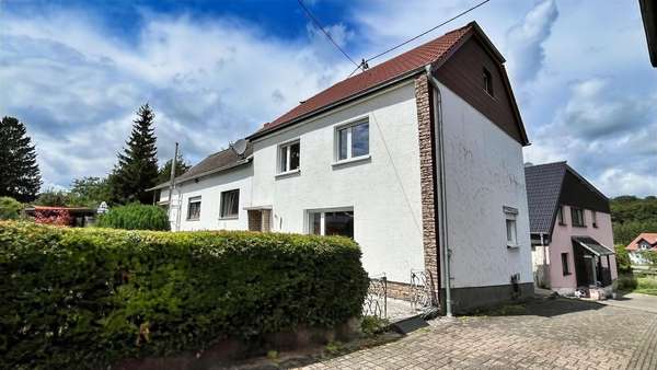 Hausansicht Hausansicht - Einfamilienhaus in 66636 Tholey mit 110m² kaufen