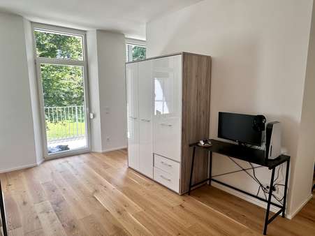 Wohnbereich mit Zugang zum Balkon Wohnbereich mit Zugang zum Balkon - Etagenwohnung in 92224 Amberg mit 46m² mieten