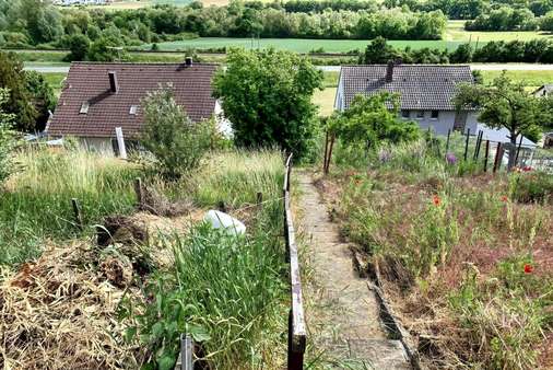 terrassiertes, weitläufiges Grundstück (Südhanglage) terrassiertes, weitläufiges Grundstück (Südhanglage) - Einfamilienhaus in 97503 Gädheim mit 110m² kaufen