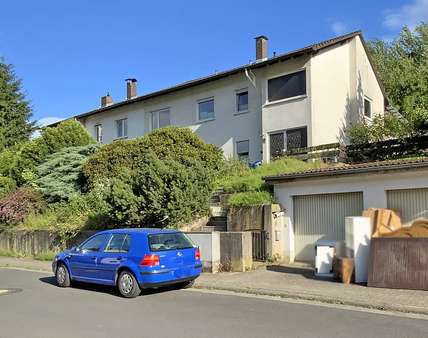 Ansicht mit Garagen Ansicht mit Garagen - Doppelhaushälfte in 63849 Leidersbach mit 137m² kaufen