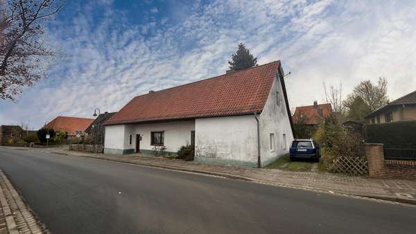 seitliche Vorderansicht - Einfamilienhaus in 29553 Bienenbüttel mit 110m² kaufen