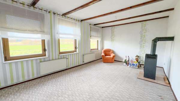 Wohnzimmer 1 mit Kaminofen! Wohnzimmer 1 mit Kaminofen! - Einfamilienhaus in 29410 Salzwedel mit 165m² kaufen