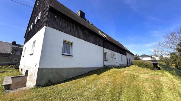 Seitenansicht Seitenansicht - Zweifamilienhaus in 09430 Drebach mit 130m² kaufen