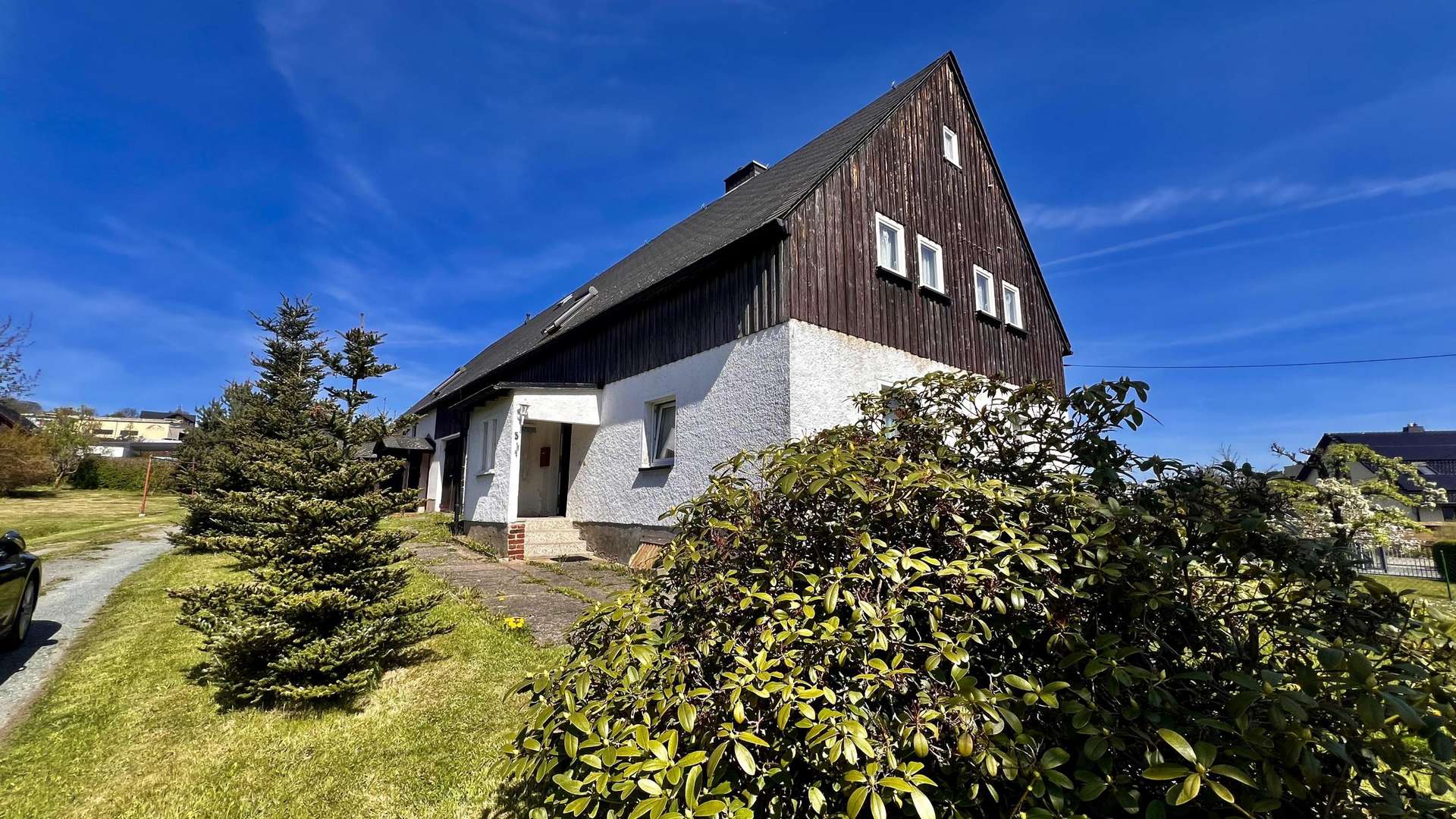 Seitenansicht Seitenansicht - Zweifamilienhaus in 09430 Drebach mit 130m² kaufen