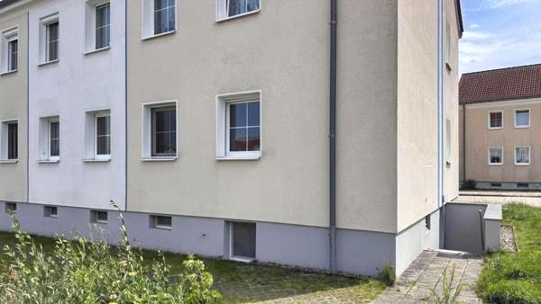 Rückansicht Rückansicht - Erdgeschosswohnung in 15890 Eisenhüttenstadt mit 60m² kaufen