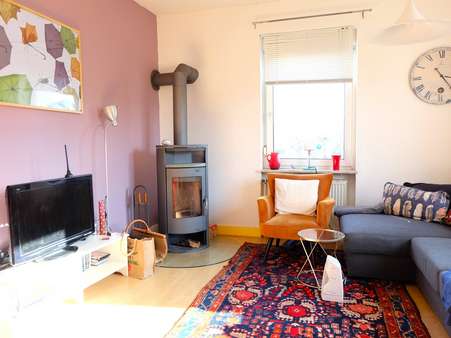 Wohnbereich mit Kamin - Einfamilienhaus in 61449 Steinbach mit 152m² kaufen