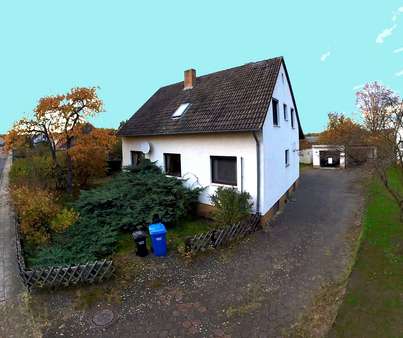 Haus mit Grundstücks- und Garagenansicht - Einfamilienhaus in 38527 Meine mit 155m² günstig kaufen