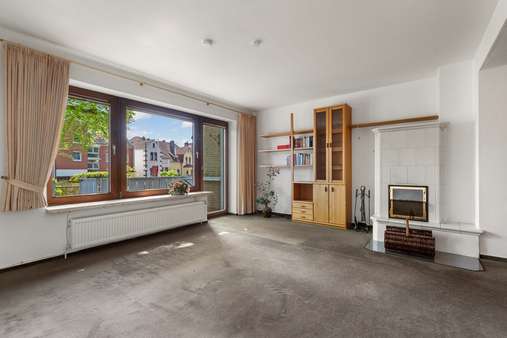 Wohnzimmer mit Terrassenzugang - Reihenmittelhaus in 28757 Bremen mit 105m² kaufen