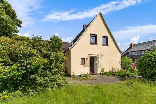 Blick auf den Hauseingang - Einfamilienhaus in 28755 Bremen mit 82m² kaufen