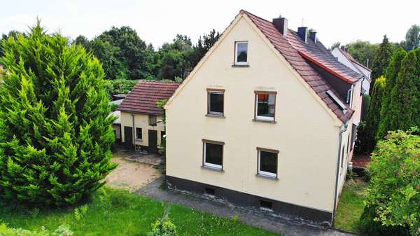 Luftaufnahme - Seitenansicht - Einfamilienhaus in 63500 Seligenstadt mit 115m² kaufen