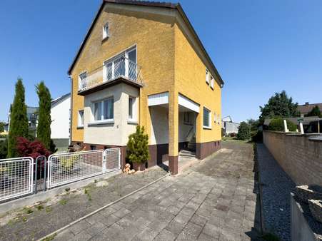 Seitenansicht Seitenansicht - Einfamilienhaus in 63110 Rodgau mit 140m² kaufen