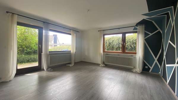 Wohnzimmer_UG - Mehrfamilienhaus in 78733 Aichhalden mit 234m² kaufen