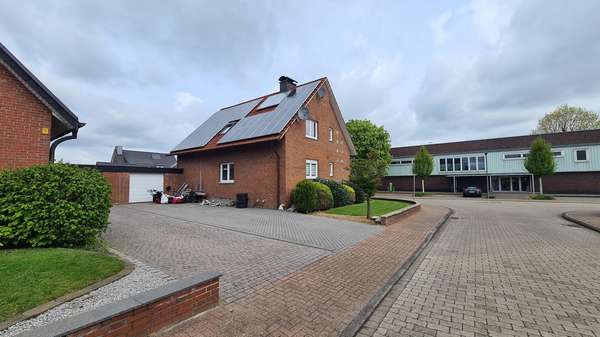 Ansicht hinten Zugang Garage - Einfamilienhaus in 48612 Horstmar mit 192m² kaufen