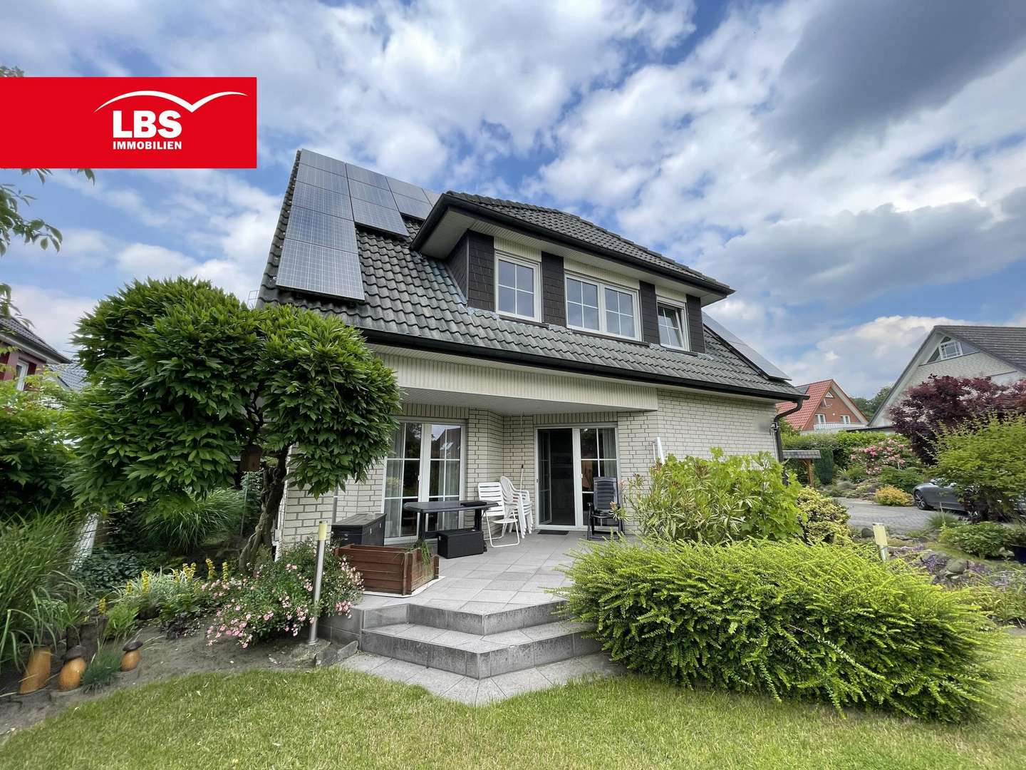 Gartenansicht mit Terrasse - Zweifamilienhaus in 49196 Bad Laer mit 199m² kaufen