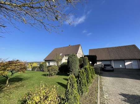 Vorderansicht mit Garage - Einfamilienhaus in 49328 Melle mit 150m² kaufen