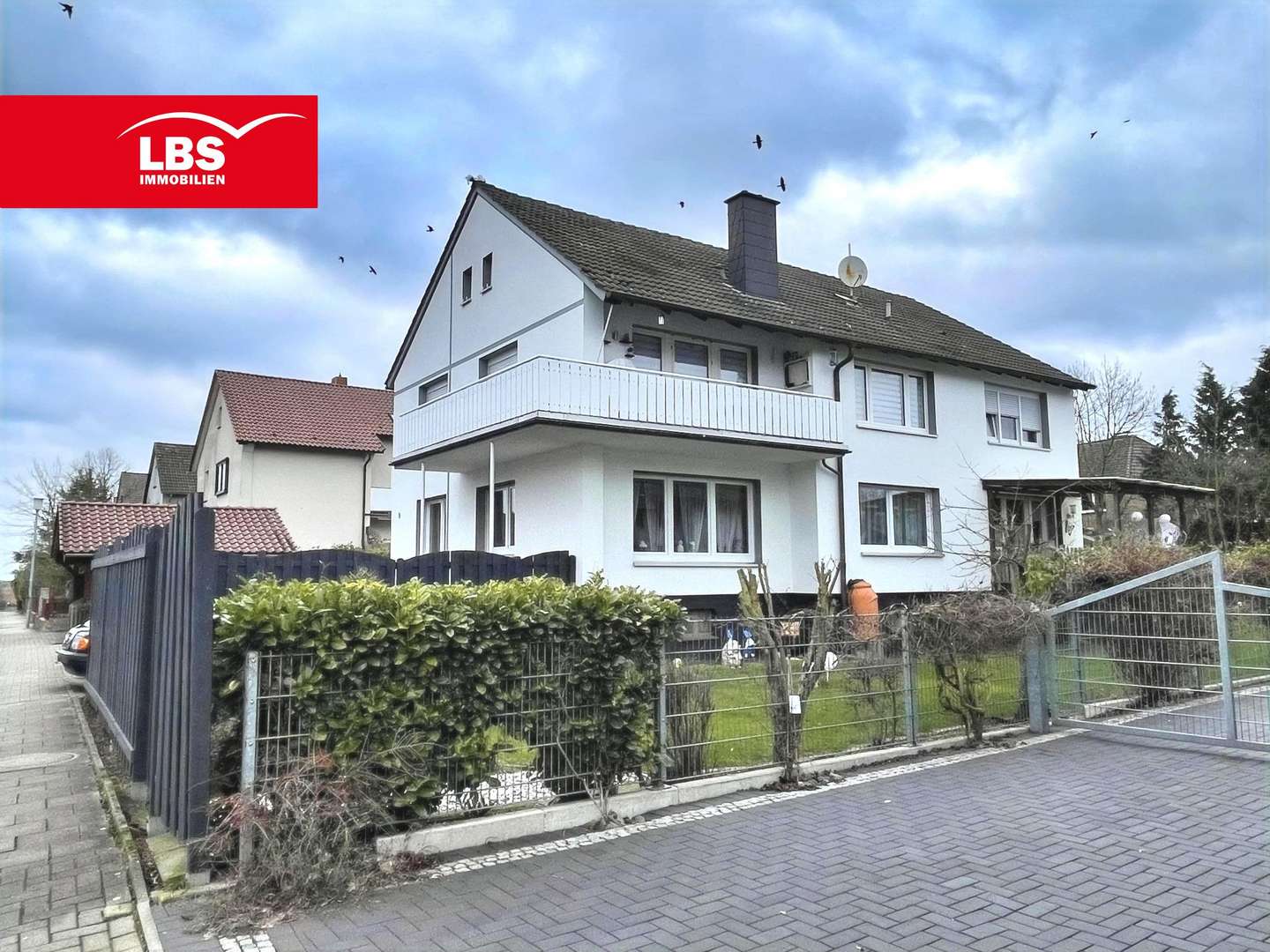 Gartenansicht mit Balkon - Zweifamilienhaus in 49205 Hasbergen mit 190m² kaufen