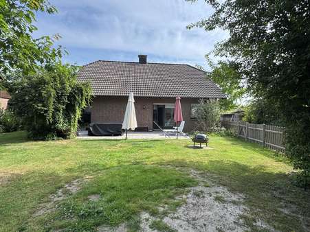 Gartenansicht Gartenansicht - Einfamilienhaus in 32791 Lage mit 131m² kaufen