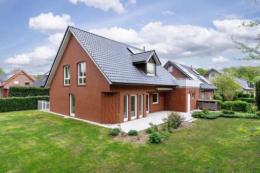 außen Gartenansicht - Einfamilienhaus in 49214 Bad Rothenfelde mit 148m² kaufen