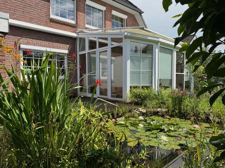 Rückansicht mit Wintergarten Rückansicht mit Wintergarten - Einfamilienhaus in 24620 Bönebüttel mit 199m² kaufen