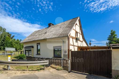 Außenansicht Außenansicht - Einfamilienhaus in 53359 Rheinbach mit 55m² kaufen
